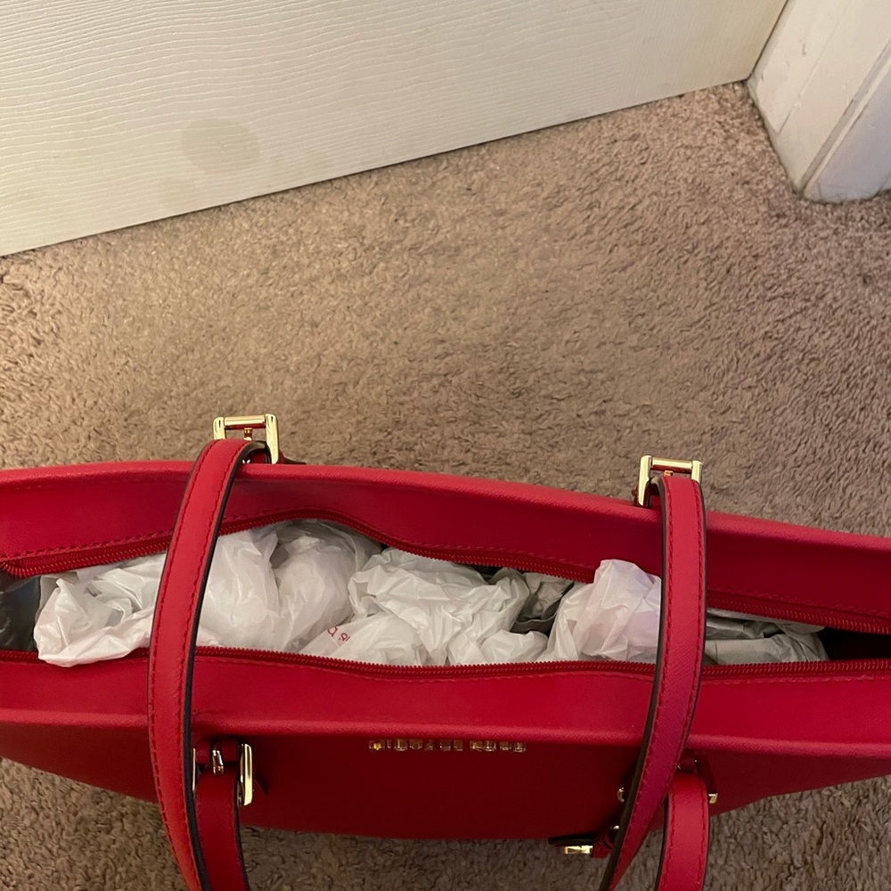 Michael Kors red tote.